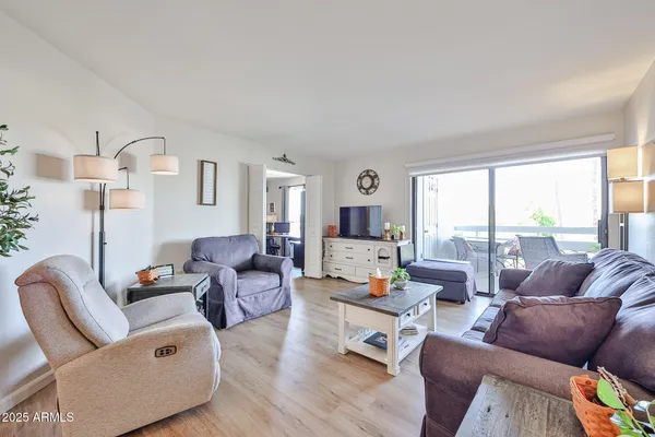 a living room with furniture and a large window
