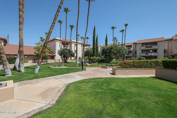 a view of a patio with a table chairs and a patio