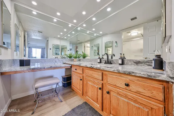 a large kitchen with lots of counter space and sink