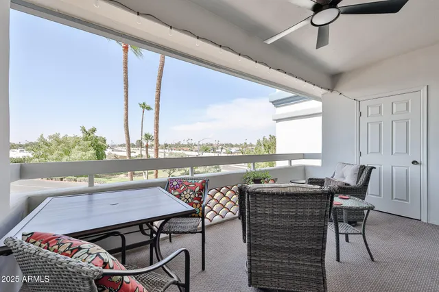 a terrace with a table and chairs
