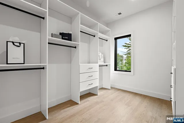 a view of a bedroom with furniture and window