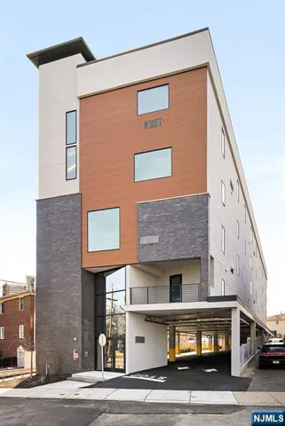 a view of a building with car parked