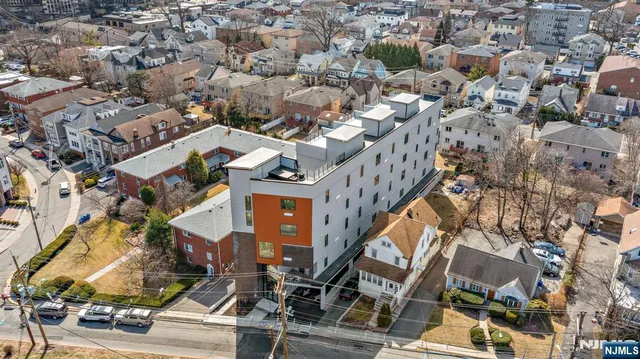 an aerial view of a building with parking space