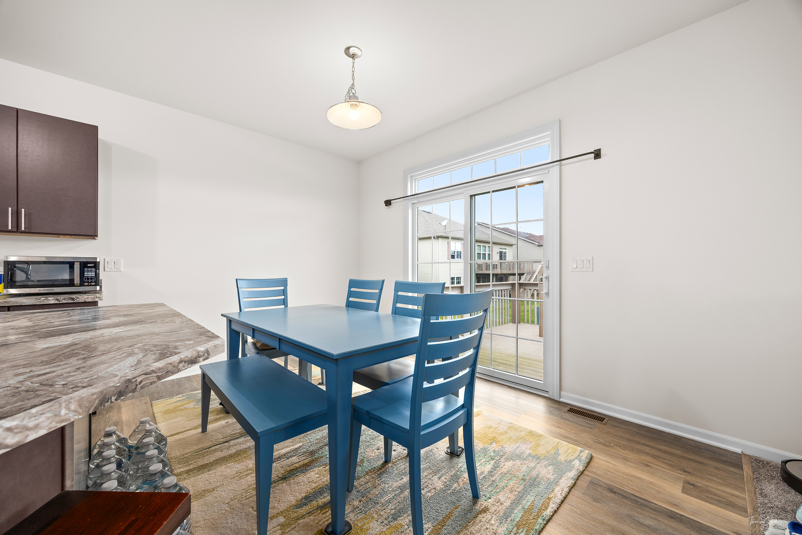 17340 Lucerne Court Lockport, IL 60441 - Photo 11 of 27 a view of a dining room with furniture and wooden floor