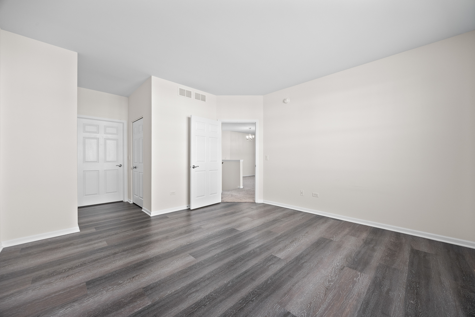 17340 Lucerne Court Lockport, IL 60441 - Photo 13 of 27 a view of an empty room with wooden floor and closet