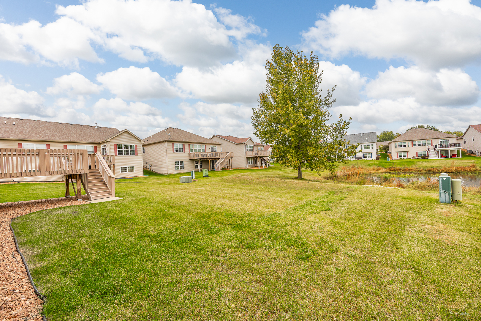 17340 Lucerne Court Lockport, IL 60441 - Photo 22 of 27 a house view with swimming pool and trees in the background
