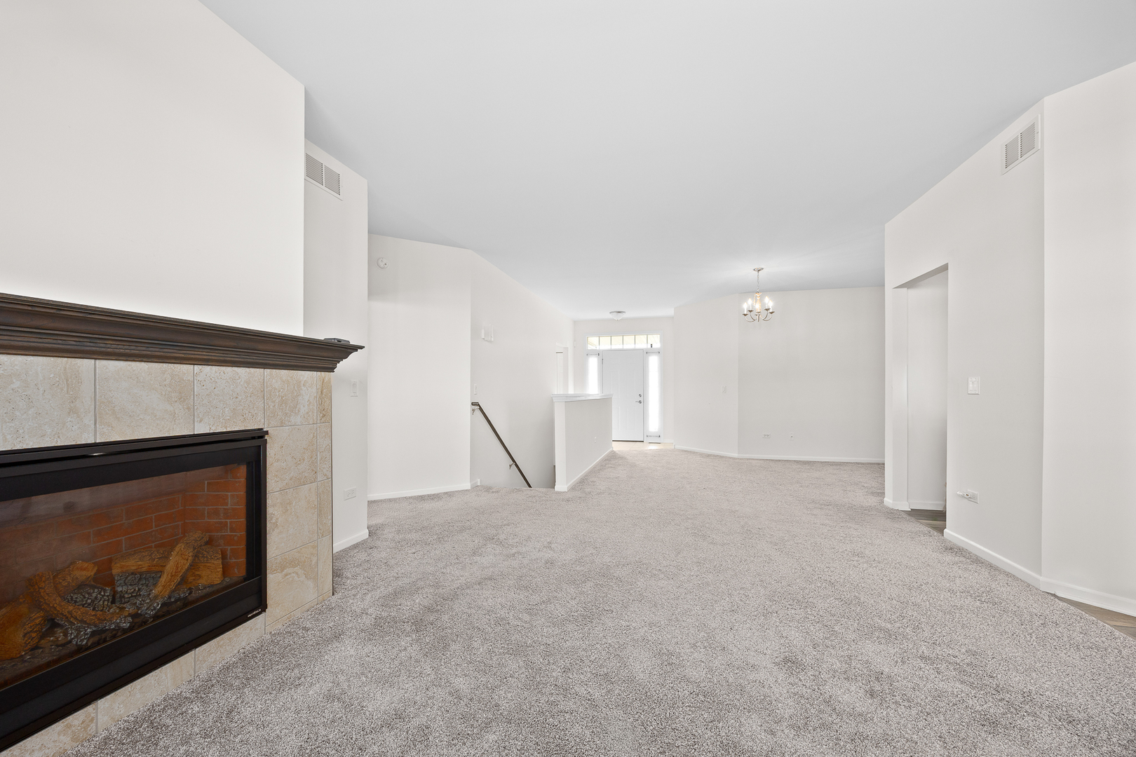 17340 Lucerne Court Lockport, IL 60441 - Photo 4 of 27 a view of an empty room with fire place