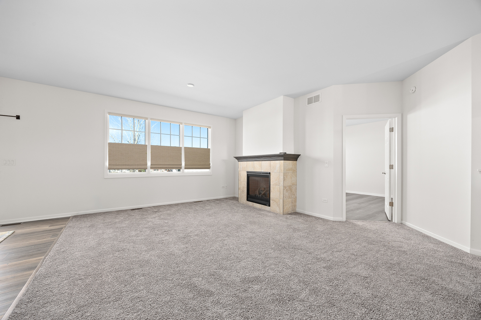 17340 Lucerne Court Lockport, IL 60441 - Photo 5 of 27 a view of an empty room with a window