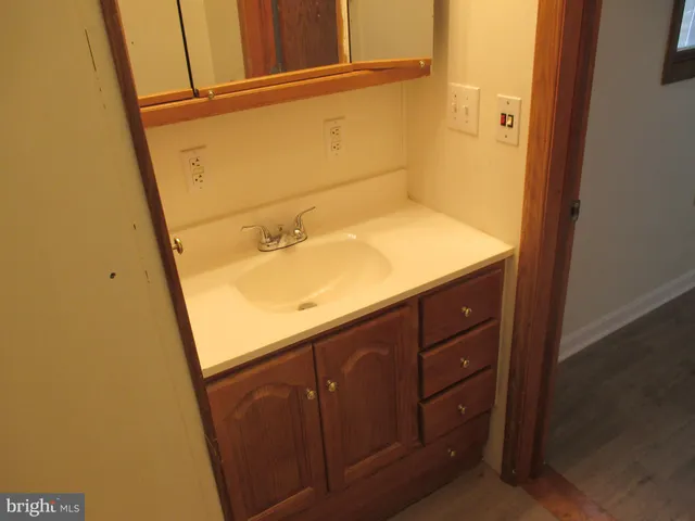 a bathroom with a sink and vanity