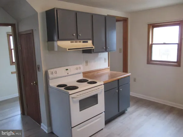 a kitchen with a stove and a sink