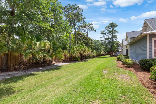an aerial view of a house with a garden and swimming pool
