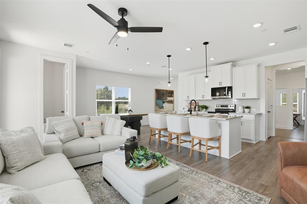 1622 Governors Boulevard Forney, TX 75126 - Photo 10 of 38 a living room with furniture kitchen area and a view of kitchen