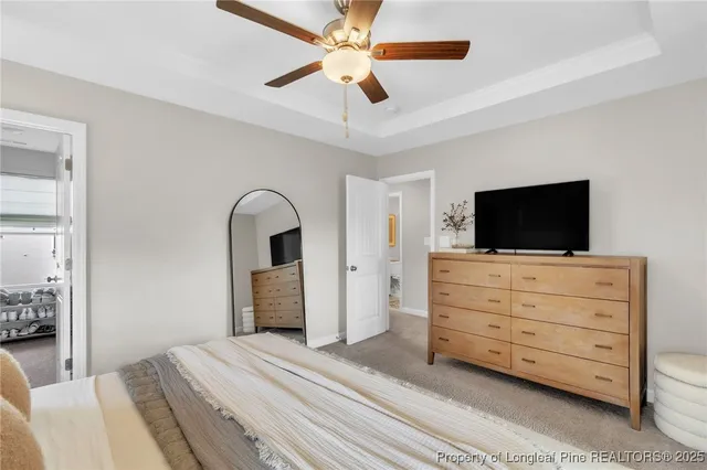 a room with a bed and a flat screen tv