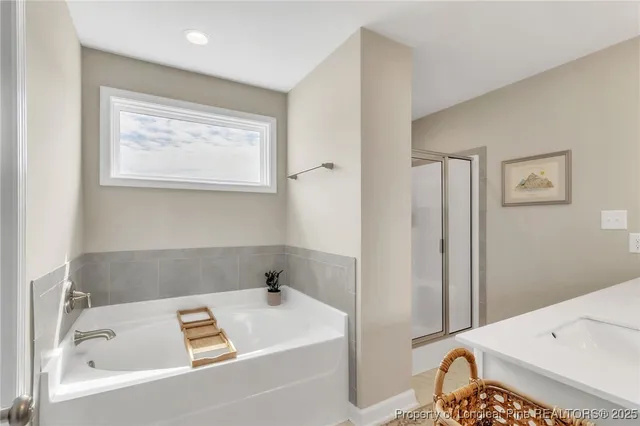 a bathroom with a bathtub and a sink