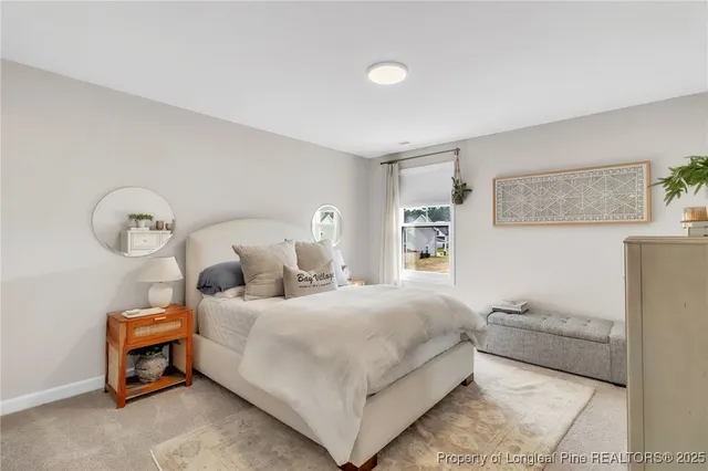 a bedroom with a bed and a cabinets