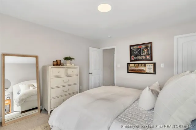 a bedroom with a bed and a cabinets