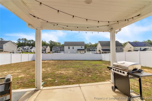 a view of a terrace with couches and lounge chairs