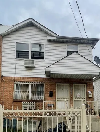 a front view of a house with large windows