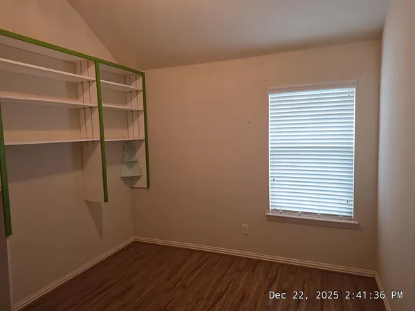 a view of an empty room with a window