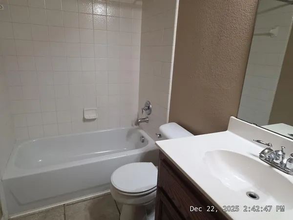 a bathroom with a sink toilet and bathtub