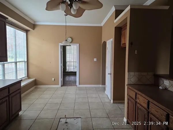 a view of a kitchen with a sink and cabinets