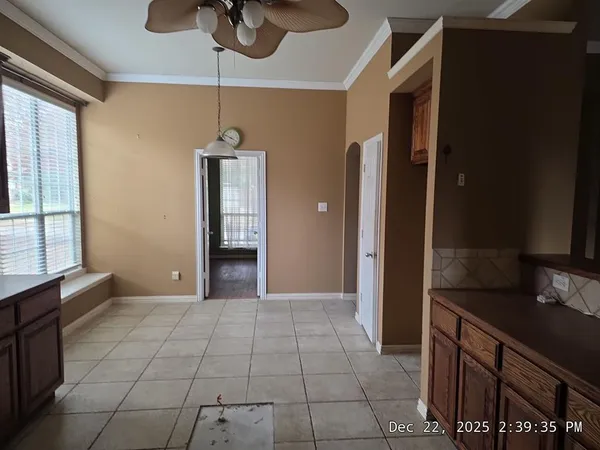 a view of a kitchen with a sink and a window