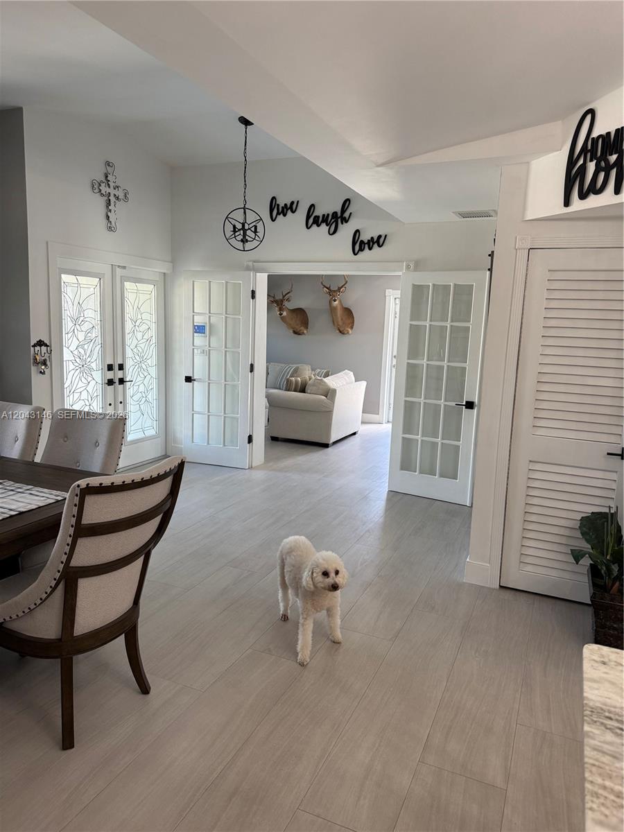 4947 Southwest 143rd Avenue Miami, FL 33175 - Photo 2 of 19 View of the entrance, recreational room, and dining from the kitchen.
