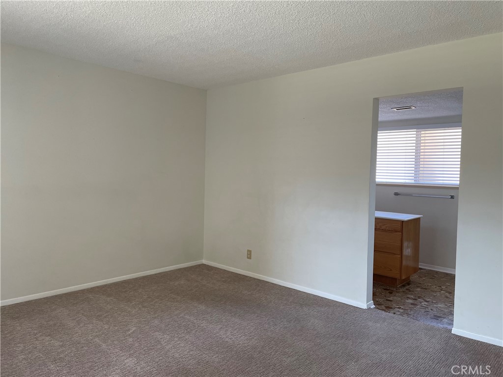 3001 Coleridge Drive Rossmoor, CA 90720 - Photo 11 of 25 an empty room with a fireplace