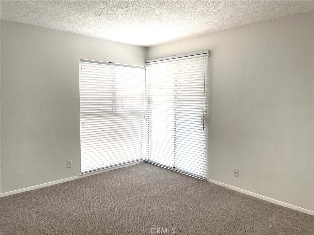 3001 Coleridge Drive Rossmoor, CA 90720 - Photo 12 of 25 an empty room with windows