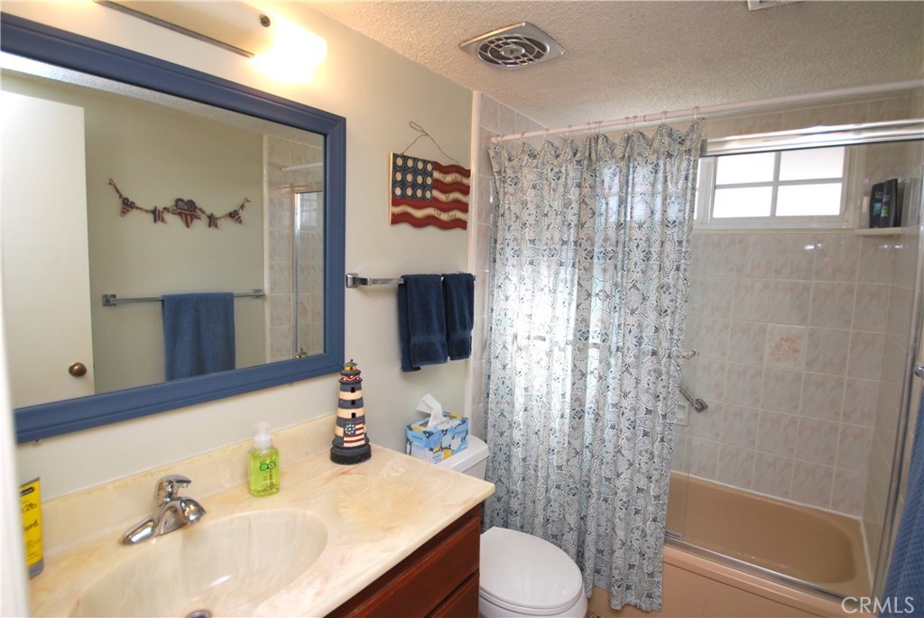 3001 Coleridge Drive Rossmoor, CA 90720 - Photo 16 of 25 a bathroom with a sink toilet and shower
