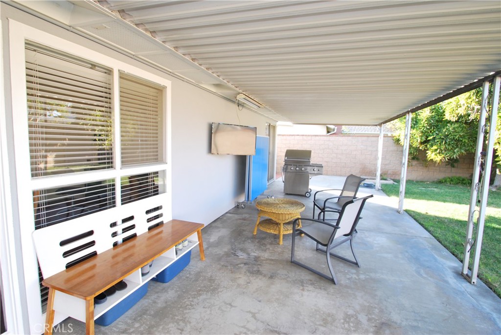 3001 Coleridge Drive Rossmoor, CA 90720 - Photo 17 of 25 a backyard of a house with table and chairs
