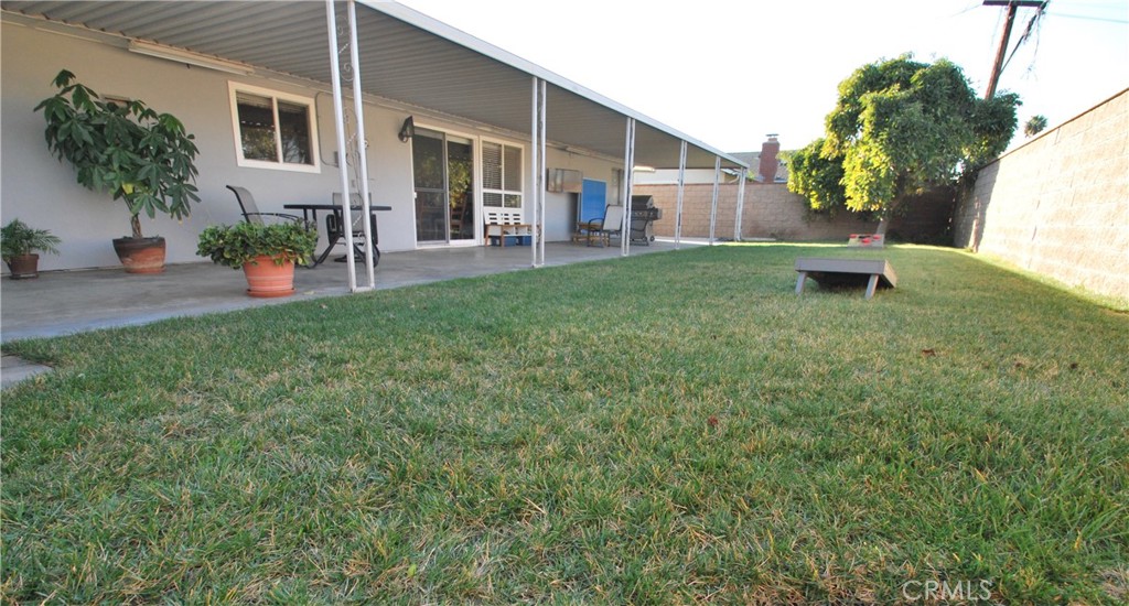 3001 Coleridge Drive Rossmoor, CA 90720 - Photo 18 of 25 a view of a house with backyard and a tree