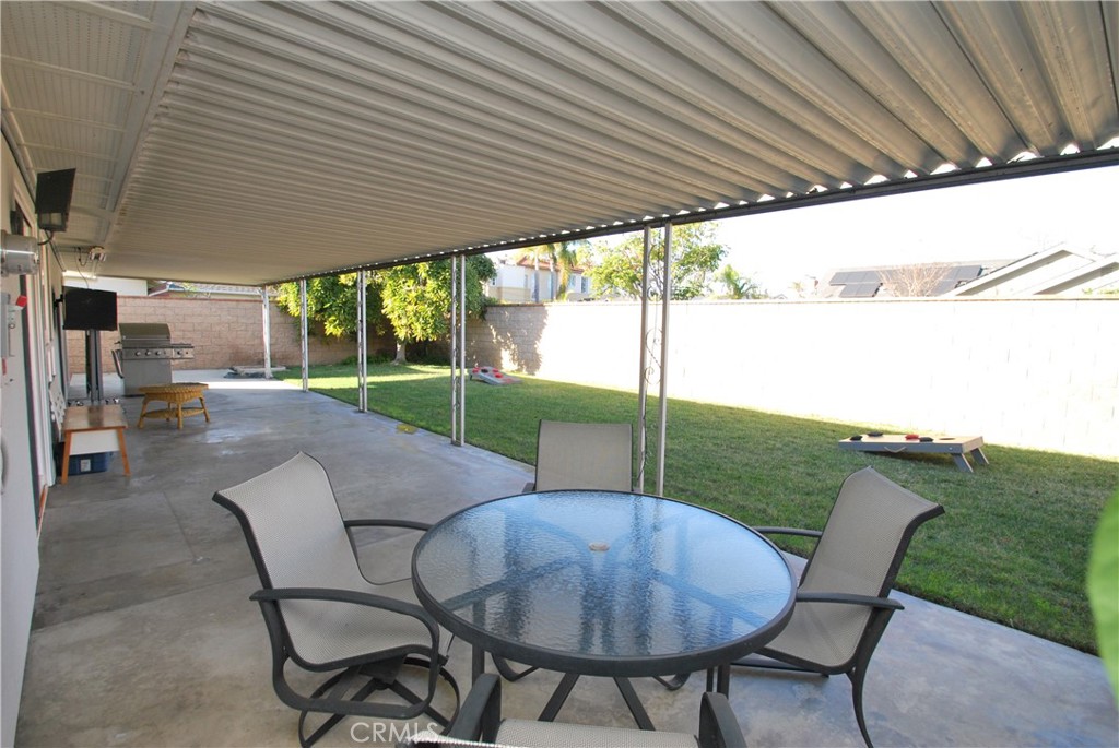 3001 Coleridge Drive Rossmoor, CA 90720 - Photo 19 of 25 a patio with table and chairs