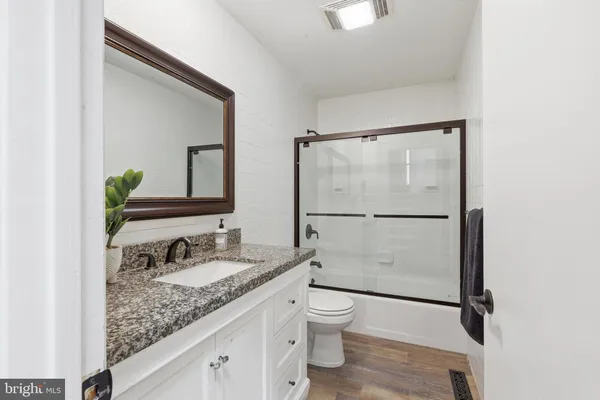 a kitchen with a table and chairs in it