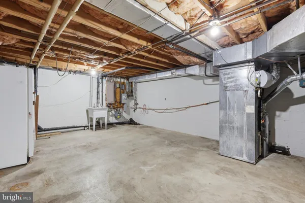 a bathroom with a shower sink and mirror