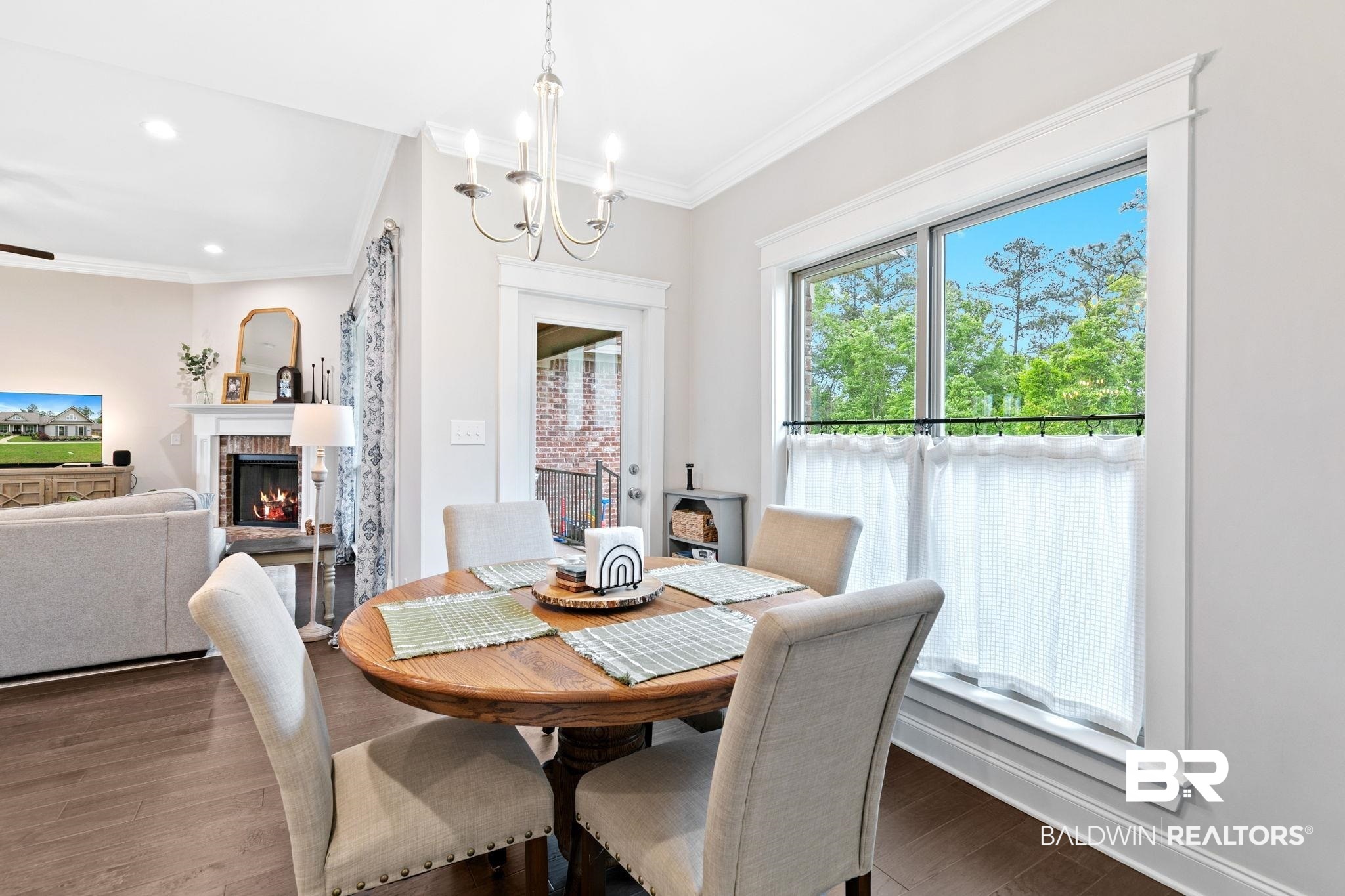 13233 Ibis Boulevard Daphne, AL 36527 - Photo 23 of 100 Dining area with a wood-finish dining table and upholstered chairs