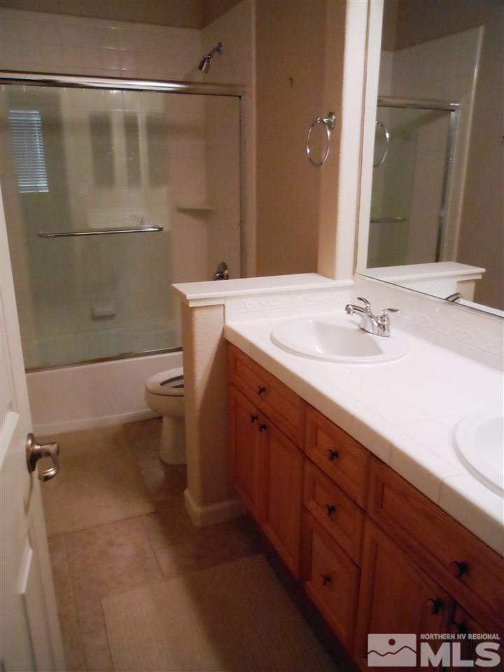 1624 Sewell Drive Reno, NV 89521 - Photo 7 of 14 a bathroom with a sink a toilet and shower
