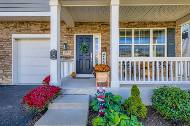 a front view of a house with garden
