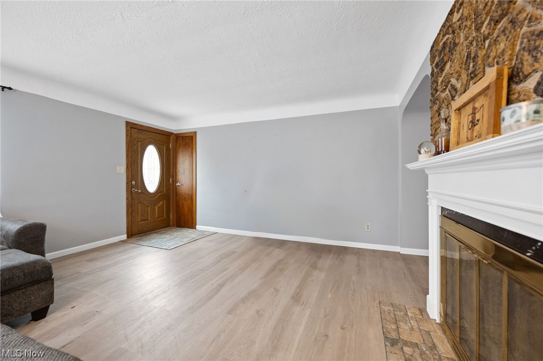 6454 Crossview Road Independence, OH 44131 - Photo 3 of 27 Entryway featuring a textured ceiling and light hardwood / wood-style flooring