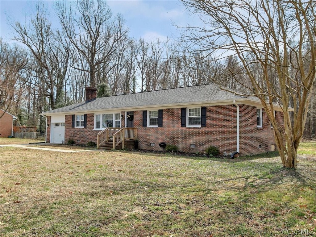1315 Covington Road Colonial Heights, VA 23834 - Photo 23 of 24 a view of a yard in front of a house with large trees