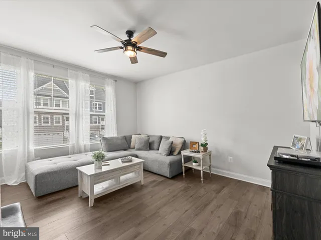a living room with furniture and windows