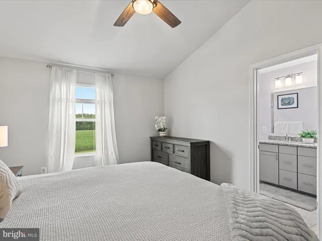 a bedroom with a bed and a dresser