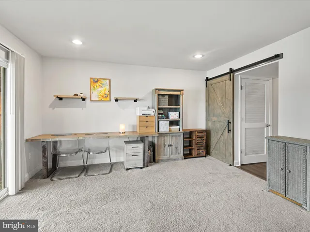 a workspace with furniture and window