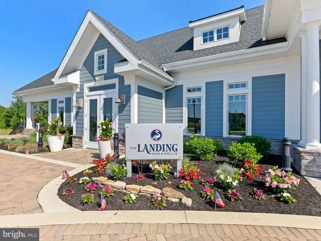 an outdoor space with furniture and garden