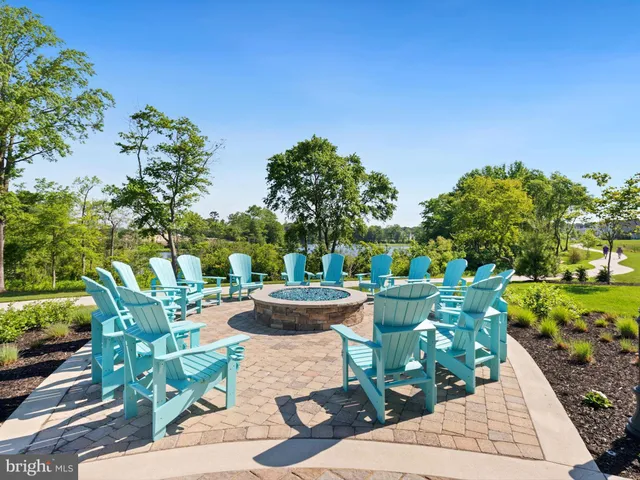 a view of swimming pool and outdoor seating