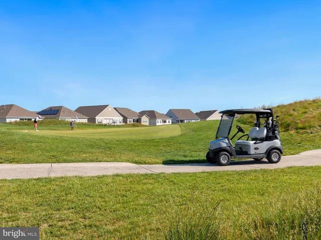 a view of a room with a table and chairs