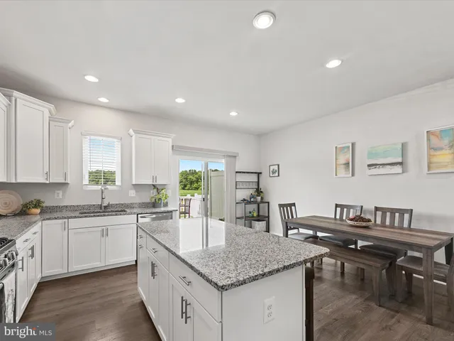 a kitchen with lots of counter top space and sink