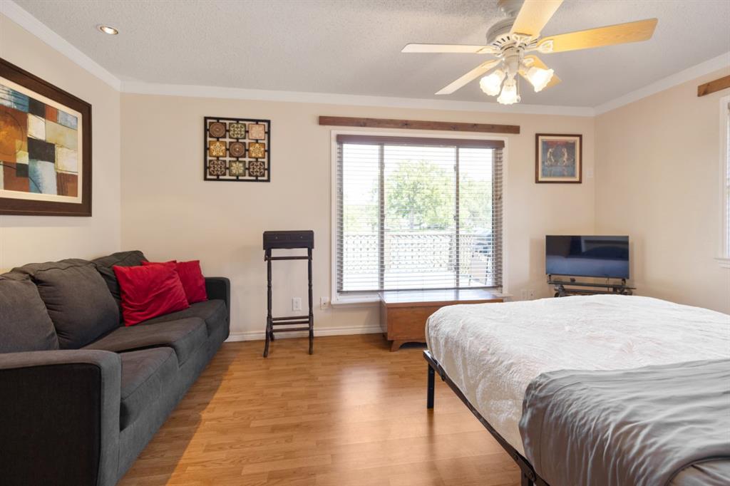 227 Scenic Road Trinidad, TX 75163 - Photo 20 of 40 a bedroom with a bed couch and window