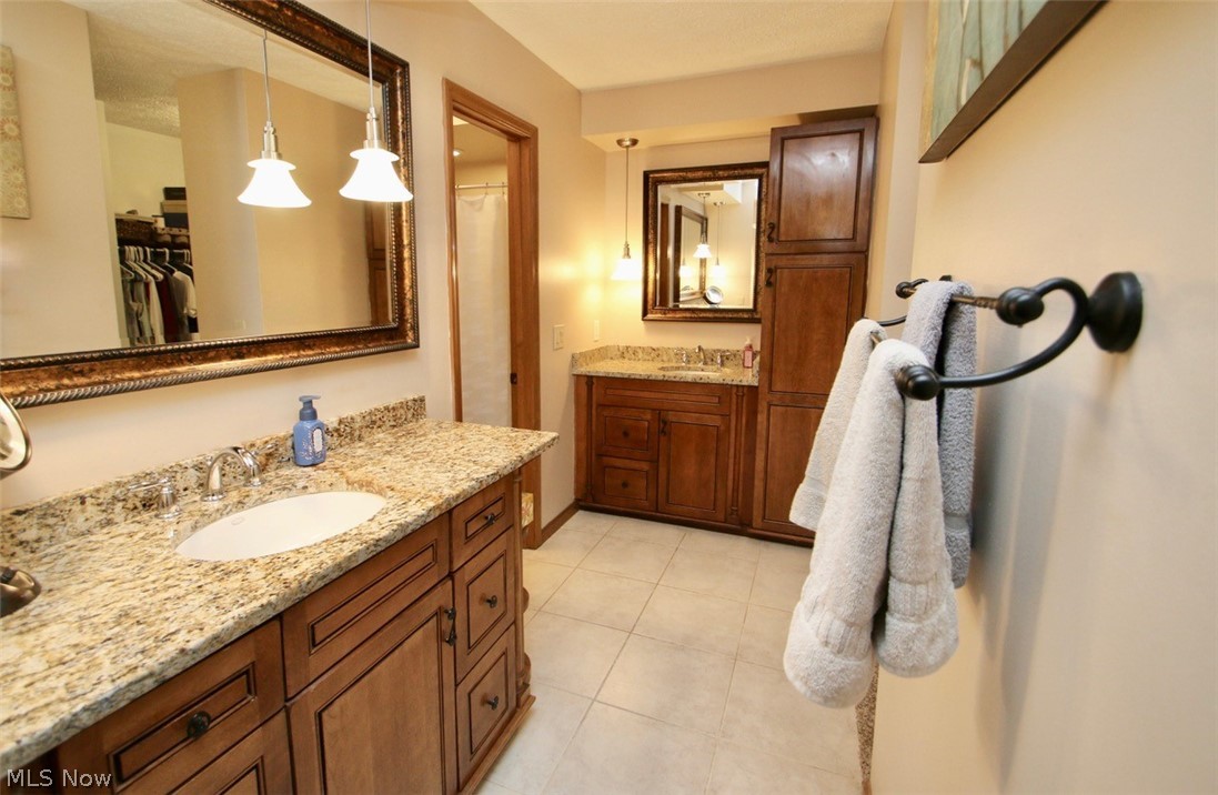 95 Park Road Painesville, OH 44077 - Photo 18 of 27 Bathroom featuring tile flooring, double sink, and large vanity