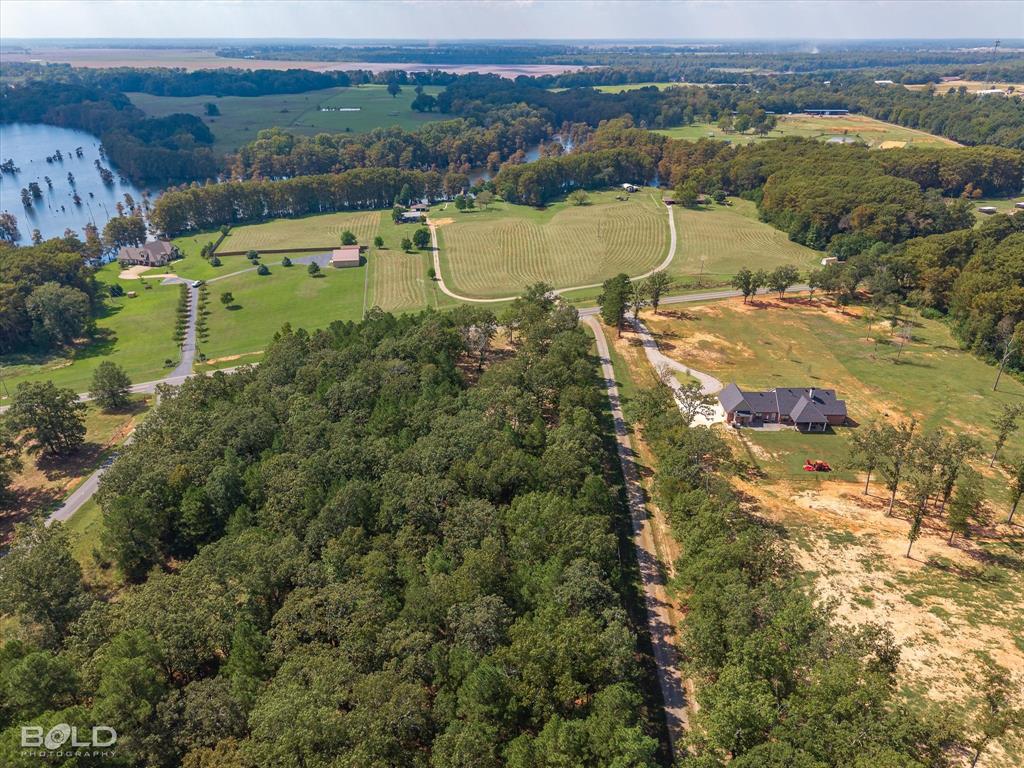 1228 Old Plain Dealing Road Benton, LA 71006 - Photo 7 of 11 an aerial view of a house with a lake view